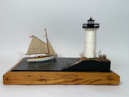 Cased Diorama of a Sloop Passing a Lighthouse