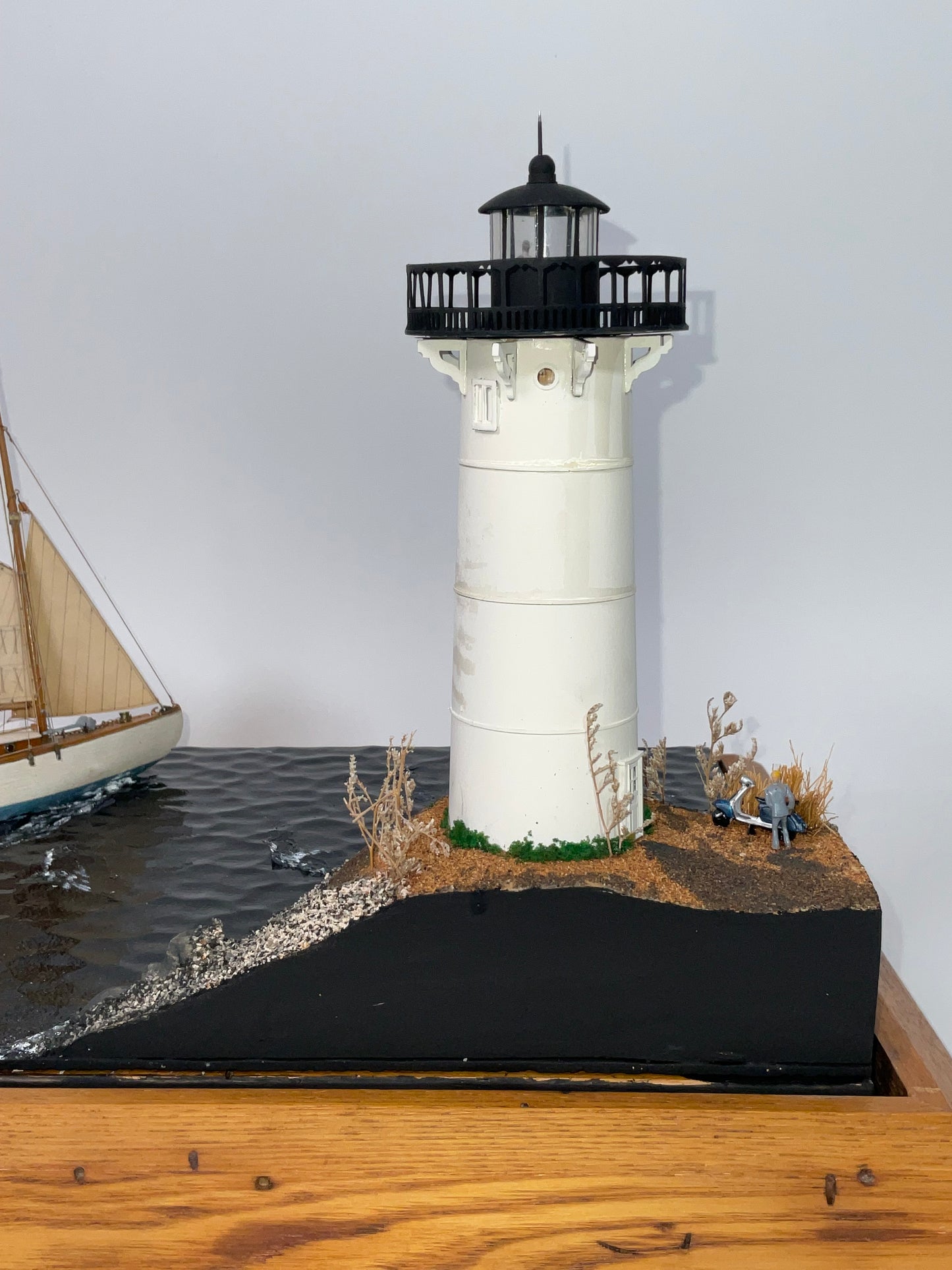 Cased Diorama of a Sloop Passing a Lighthouse