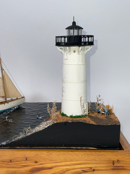 Cased Diorama of a Sloop Passing a Lighthouse