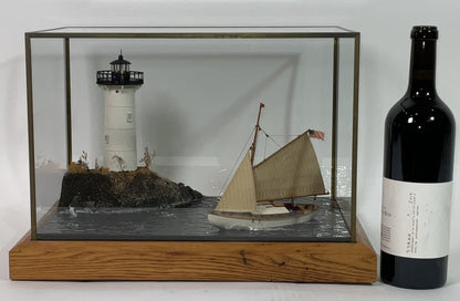 Cased Diorama of a Sloop Passing a Lighthouse