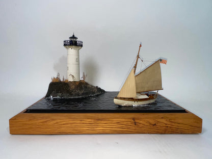 Cased Diorama of a Sloop Passing a Lighthouse