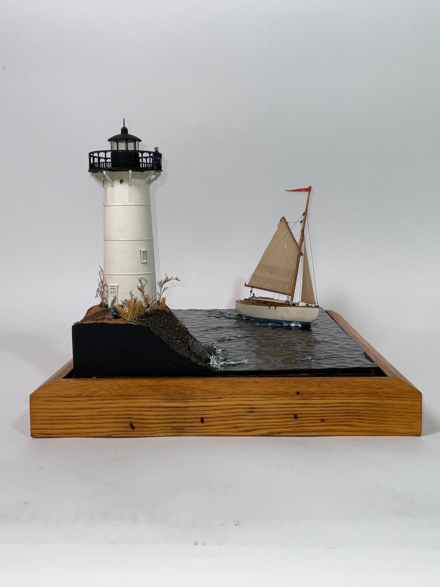 Cased Diorama of a Sloop Passing a Lighthouse