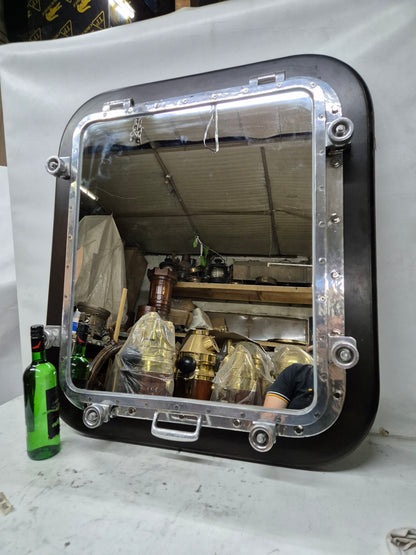 Ship's Porthole Transformed into a Wall Mounted Mirror