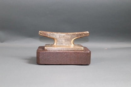 Brass Cleat Mounted to Wood Base - Lannan Gallery
